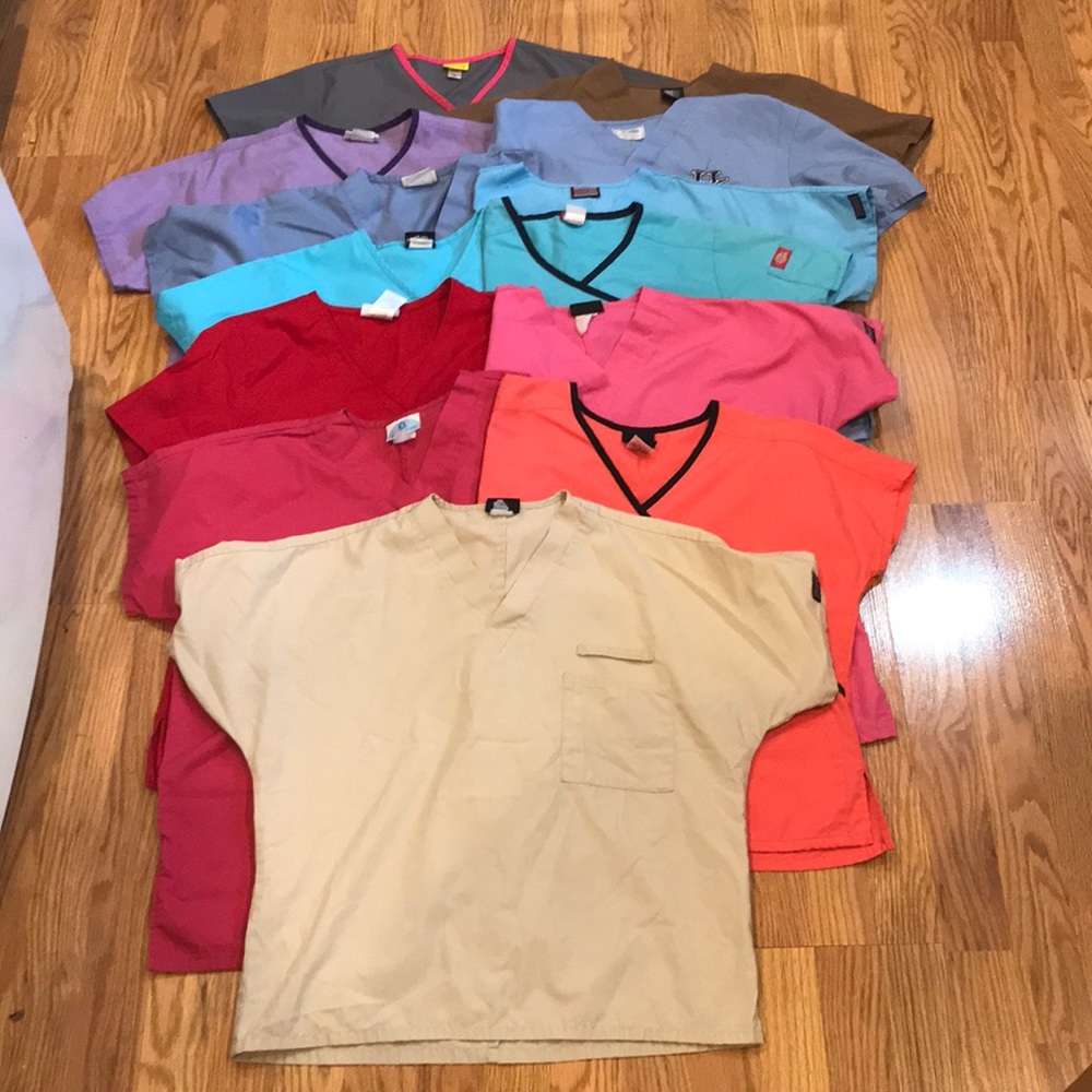Lot of scrub tops. Sizes vary. MEDIUM FIT
